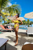 Well, the model obviously looks better wearing it than I do but I love this swimsuit! I went back and ordered blue! I had to order L in top due to my breasts but I wear S/M in bottoms. I ordered M and I love the high waist fit! I will prob order more colors too! - Jackie A.