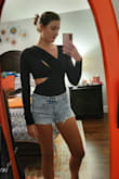 This bodysuit is surprisingly soft, warm, and very comfortable. Fits true to size. The cutouts can be shifted to show more or less skin. I would assume that the higher crossover may show more skin for someone with a larger chest. - Kelsey L.
