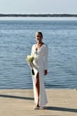 I intially tried on a medium and it was way to big in every aspect besides the length! The small fit perfectly for my wedding day! Just had to add cups and it was the most elegant, affordable and stunning ( as so many called it)! My husband loved the way it hugged my curves and showed a leg with the high slit! Definitely would recommend Lulus for you wedding dress > - Amy S.
