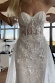 This dress is EXACTLY what I tried on at one of the trendy bridal boutiques - only instead of it being 4 different custom dresses that would all be created to my liking and priced at $5K+... it was already perfect and SO much cheaper! The colors and everything were perfect, fit was amazing, lightweight and comfy. 

Say NO to the (expensive) dress and YES to ~savin' yo money~ :) - Natalie D.