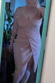I liked the dress. I could have sized down. Probably needs a stitch in the leg slit, I was really worried everyone would see my underwear while I was walking. The back tie part was a little loose but would have been fixed with me sizing down. Its a shiny material when the light hit its. Material has stretch to it - Katherine C.