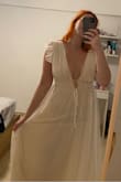 Fits to size. Nice cleavage. Try to tape shoulders if you can so sleeves dont move much - Raquel T.
