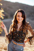 I love how this body suit! It fits nicely, it is comfortable and the material is very soft. I wore it for our family photos along with Jeans and shoes from Lulus as well :) - Desirey P.