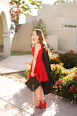 I wore this dress for my grad school pictures and it fit great! Such a cute dress, loved the fit and flare. Also, the color was beautiful and bold. - Leah M.