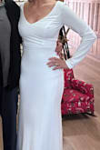 This dress fit like a glove and hugged all of the right curves. The back is lovely with the row of buttons and the sweetheart neckline in the front shows enough cleavage to be classy but not overboard. Also, it is COMFORTABLE. I could sit down and visit easily with everyone. - Ashley B.