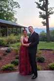 I wore this dress for my friend's black tie wedding over the summer. I stood out from the crowd of dark color dresses with this beautiful pink. The dress runs a little on the small side, I had to crash diet and lose about 6 pounds to fit into it and still be able to breathe. I had recently gained weight so I was guessing on the correct size and probably would have been better off with a large, but I made it work! It was absolutely worth it, this dress is more beautiful in person than what pictures can capture! The adjustable straps stay in place and the organza is smooth and silky. With the poofy nature of this dress it was hard to see the front slit. It was perfect for a formal evening wedding. - Vanessa T.