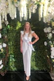 I wore this for my bridal shower and added a belt! The medium was more form fitting so I decided to go with the large so I had room to move around. The length was perfect for my height. I received so many compliments and felt so beautiful. I would highly recommend! - Jessica W.