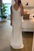 I knew I wanted a simple and affordable but flattering wedding dress and this is it. The material is soft and stretchy which will allow me to sit, eat, and dance! I recommend looking at the pictures from customers to see if you like it. The dress on the model is clearly too small for her (the waist is too high and the dress is too short). The dress looks way better in person - Lizzy L.