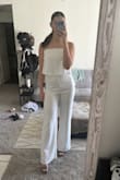 I am wearing this to my engagement party tomorrow night and it is the perfect look! It is so flattering and I can't wait to wear it. It is pretty long on the legs so I have to wear heels. People who are shorter would probably need it hemmed. - Morgan M.