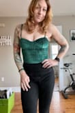 I originally ordered a small which is my usual size but it gave me a massive wedgie and barely covered my boobs. There is not enough material to cover the length of my torso and I'm pretty short. 5'4 So definitely size up, especially if you're tall or have a longer torso. Returned it for a medium and that fits well. Love the material and color. - Rachel H.
