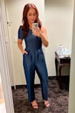This jumpsuit is so chic and it was perfect for a December wedding! Agree with other reviews that the chest area is a little tight. I have a small bust so it wasn't an issue for me, but the arm/shoulder was a little tight when trying to dance. I ordered both a small and medium and kept my true size small. - Lindsay D.