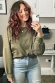 I am obsessed with the look and fit of this twisted sweater. I ended up purchasing all of the colors and they all look so amazing on with different bottoms. I love how it connects at the top. Nothing is more annoying to me than having to continue to adjust my top. Its perfect! - Jessica R.