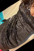 I purchased this on a whim, I'm post Partum and wanted something to wear to a wedding that wasn't entirely "mom gear" this was beautiful! While I will need cup bras (breastfeeding) this fit perfectly (size medium) and was beautiful on. Very comfortable. I would recommend. I have a little pooch and it didn't disappear but it definitely didn't hug it. - Jacqueline F.