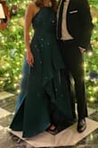 I wore this to a festival of trees gala and got so many compliments. I definitely had to iron it after the shipping packaging, but I figured that would be the case. I am small chested, so it fits me well, but I could see it being tight on the top for those that have larger chests. - Julie R.