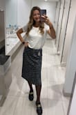 Not super see-through and pretty comfortable. Great for dressing up or down, I really like how this is a bodysuit so it always stayed tucked in. - Rachel D.