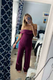 I really love this jumpsuit -- it doesn't fit me perfectly because I am so tall but it works. The torse cuts me off a bit. The arms are also a bit loose but if the rest of the jumpsuit fits you well it's easy to get them tailored. Really pretty color and comfy material - Rachel D.