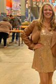 Perfect fit. I have belly issues and this was not clingy. I would say true to size. Wore to a company holiday party and got tons of compliments!! - Megan C.