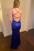 This dress fit me absolutely perfectly. It is so flattering, tight in the right places, and the back is gorgeous. The length on me was great with 2-3 inch heels. It is breathable and easy to move in. Great for prom or a wedding!! I didn't get a picture of the front, but it is modest and beautiful! - Abbey D.