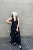I ordered this dress in navy and black for a black tie wedding I had. The navy was very pretty but black fit the dress code better. I'll say the chest was very large on me, which might be because I'm an A cup. If I had had fashion tape then I would've been much more comfortable. I would honestly say to size down and have your fashion tape ready. - Anna E.