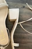 Bought these for my daughter for a wedding. We received and tried on, they fit perfectly. Day of wedding the strap that is held at bottom of shoe came loose. Very poorly made. We didn't have a back up pair and she had to borrow shoes from someone else. - Helene S.