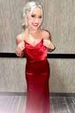 This dress was stunning!! The red silk fabric looked incredible in person. I got so many compliments. Only thing I have to mention is a strap did break on the first night of wearing it. - Melissa M.