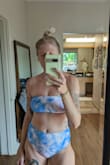 I love this swimsuit. The top stays on really well. I never feel like I have to pull it up. I probably could have gotten with the medium, felt like I spill over a little but the small worked alright. The color is great and just like the pictures. I didn't mind that there weren't cups, I always pull them out anyway. - Holly R.