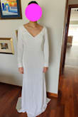 The dress is beautiful, the fabric feels heavy and expensive. Looks better in person than in pictures. The back cleavage is flattering and the buttons are a nice detail. Sleeves and length are a little too long but that's easy to fix. Shoulders fall off a little bit so I might use some fabric tape to keep them in place. - Daniela V.