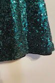 I was very excited about this dress but when I opened the bag, it was quite what I was expecting. The color is more of a blue-ish green than dark green. I also have a long torso and this falls juuuust below my butt. I'll have to wear shorts or figure something else out but it would be indecent to wear as just a dress. The real issue is that the liner hangs below the outer layer of the dress. I bought this final sale for $15 so I'm not too mad about the length/I knew it was a risk but the liner issue is disappointing and I definitely wouldn't pay full price for this dress. - Kaitlin L.