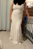 I really liked this dress! Originally ordered an XL (what I'm wearing in the photos) but went with a large. It's so elegant and flattering on. I am large-busted so a nice push-up bra will be needed to take it to the next level. Sequins were lovely throughout and the tulle made for whimsical feel. Possible wedding dress! - Elizabeth C.