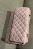 Really the perfect sized purse and an elegant color that goes with everything. 
The clasp is a bit tricky so if the purse is not full all the way the clasp can difficult to manage but other than that a beautiful purse. - Hetal T.