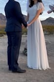 I loved this dress!! I used it in a small ceremony outdoor wedding and it was perfect. It arrived quickly and fit great (a little long, I could have used higher heels). The fabric is really white and had no defects. - Patrycia N.