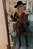 Loose in the waist but it stays up fine since I have hips and a butt. Definitely could go down a size. I have it in black and the brown Color. - Jennifer K.
