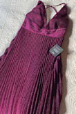 I'm disappointed at the color of the dress. I was expecting to receive a burgundy-like gown, as seen on the images, but received more of a pinkish dress. If your are looking for a wine color gown, this is definitely not it. Other than that the dress fits nicely and has a beautiful silhouette. - Andrea B.