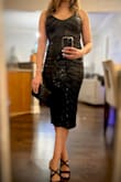 I ordered a large and a medium in this dress. I decided to keep the medium as it hugged my curves better. The large had a little bit more breathing and wiggle room. The dress was comfortable and I did not have to keep adjusting myself through the evening. Received many compliments. - Helen N.