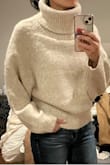 I confused myself with this sweater because I tried it on with sweatpants and hated it. Everything is big and it made me feel big. Except the turtleneck part which is amazing. So I went back to my order to see what convinced me to order this, and it looked so cute on everyone. So I threw on some skinny jeans and voila! I loved it. So, it's definitely a big poofy sweater. Balance it with a mini skirt or skinny jeans! The turtleneck part is the best I've found all season. Photos cropped strangely upon uploading, but tried to give the gist of it. - Crystal W.