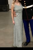 It was well made and pretty, but very long even with heels (granted I am 5'2"). Tried to get it altered but due to the beading it was going to cost over $100 for the altercation - Meredith S.