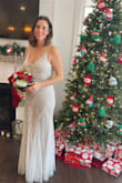 I was a little hesitant buying a wedding dress online but this dress is amazing. Even with doing express shipping to Canada and with the exchange rate this dress was so affordable. Taking it out of the box, it looked and felt like a Million dollar dress. The quality is top notch. I saw another review that said there was no extra beads ir sequence but there is, it' just attached to a tag on the inside of the dress. I did have the dress altered a tad. Changed the criss cross straps to regular straps. Had boning added to the sides and the mesh in the middle to add a bit more structure. I also had some Boogie cups added. The length was perfect with a pair of wedges. For the price you cannot go wrong, - Meghan S.