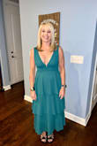 Absolutely love this dress! Color is gorgeous and fit is very flattering to the point that no Spanx needed! Bought a medium and fit perfectly, although I did have the shoulders taken up ever so slightly. Wore it to a December wedding, paired with black heels and a black faux fur wrap. Only needed pasties and some double sided tape! - Susan M.
