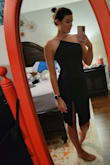 This is the perfect little black dress. Material is thick enough to smooth out any imperfections. The length of the dress hits at my knees, but there is a substantial slit. Really love the neckline and back. Have not worn out yet, but looking forward to doing so. - Kelsey L.