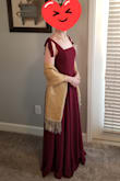 I bought this to be a bridesmaid dress for a friend's wedding - it is such a lovely dress! The color leans more bluish than reddish as far as burgundy shades go (which is what I wanted but may not be for everyone). The straps are faux-tied which provides better security since I don't have to worry about them coming untied as much. I did have to shorten the straps a little, but I doubt that most people will need to do that. - Amanda N.