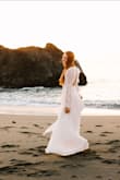 Tall girls rejoice! This is the perfect dress for tall girls. Order a size down, I'm always a Medium, and a Small fit perfectly. Used for engagement photos, and it is just perfection. - Allison J.