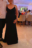 This dress is very basic but beautiful. The fabric is high quality and is very nicely done. It has an extra layer of fabric around the belly that holds everything on its site. I would recommend it! - Mariel O.