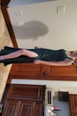 Dress is very form-fitting and flattering. The material is substantial and not flimsy. Dress is lined and has a covered zipper. The slit is thigh high fyi. Overall pleased with purchase! - Dana P.