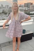 Fits perfectly, super cute! I wear it all the time. Also great for a casual day of work if you put a cami on underneath! - Brittany B.