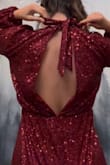 I absolutely am crazy about this outfit. Love a romper, it has a nice open back and is stretchy! It's a little on the short side, and the sparkles would get stuck to each other (I.e. the sleeves would get stuck to my waist) but that really wasn't a big deal. 10/10 recommend for your next holiday party. - Claire S.