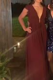 I love this dress, but I will definitely have to get it tailored. I wore it to a wedding unaltered because I didn't have time to get it altered and the bust and waist were quite loose on me. I wish I would have sized down. The color is also a bit more purple in person than in the photos. - Lauren M.