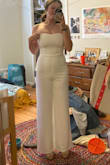 Loved it! I ordered a small and a medium, and the small was a better fit. The medium was just a little too loose, so it looked wrinkly and not as nice, just wasn't as flattering, specifically in the bust area. The small was definitely tight, but fit like a glove! Had to squeeze the zipper together to zip it up, but honestly how tight it was helped keep it up. Material is nice quality! A little sheer, I needed to find nude undergarments. It is also a little stretchy which helped it fit better. The pants were long for me but with heels it was a perfect length. - Madeleine M.