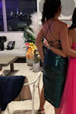 I LOVE this dress. Fit well, comfortable, great color, fabulous! Lightly padded so I didn't need a bra. I didn't dance in it so I have no review on that specifically. With the high slit and open back it's a great option for a sexy dress if you don't necessarily want a super short skirt. - Alexis L.