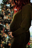 I am 28 weeks pregnant and was looking for a bump-friendly dress for a Christmas Eve party and this was the perfect dress! It's soft and so flattering! I am usually a small or medium pre-pregnancy so I opted for a medium. I received so many compliments and it also came out great in pictures! - Laura R.