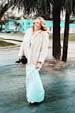 This dress is gorgeous. I'm tall and it still drug the floor. I wore it on Christmas Eve, with a fur coat and it gave me the vibe I wanted. Love the fabric. It's thick and pretty and when you steam it, all wrinkles fall right out. It cleaned well as well. - Courtney S.